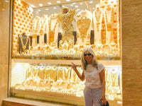 A guest pointing out a gold jewellery window in the Gold Souk in Deira